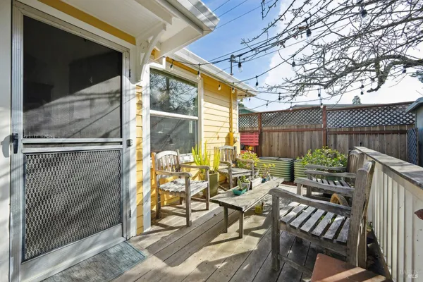 a view of a backyard with sitting area