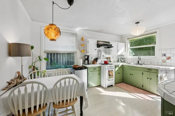 a kitchen with a stove and cabinets