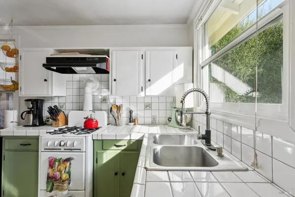 a dining room with furniture and a window