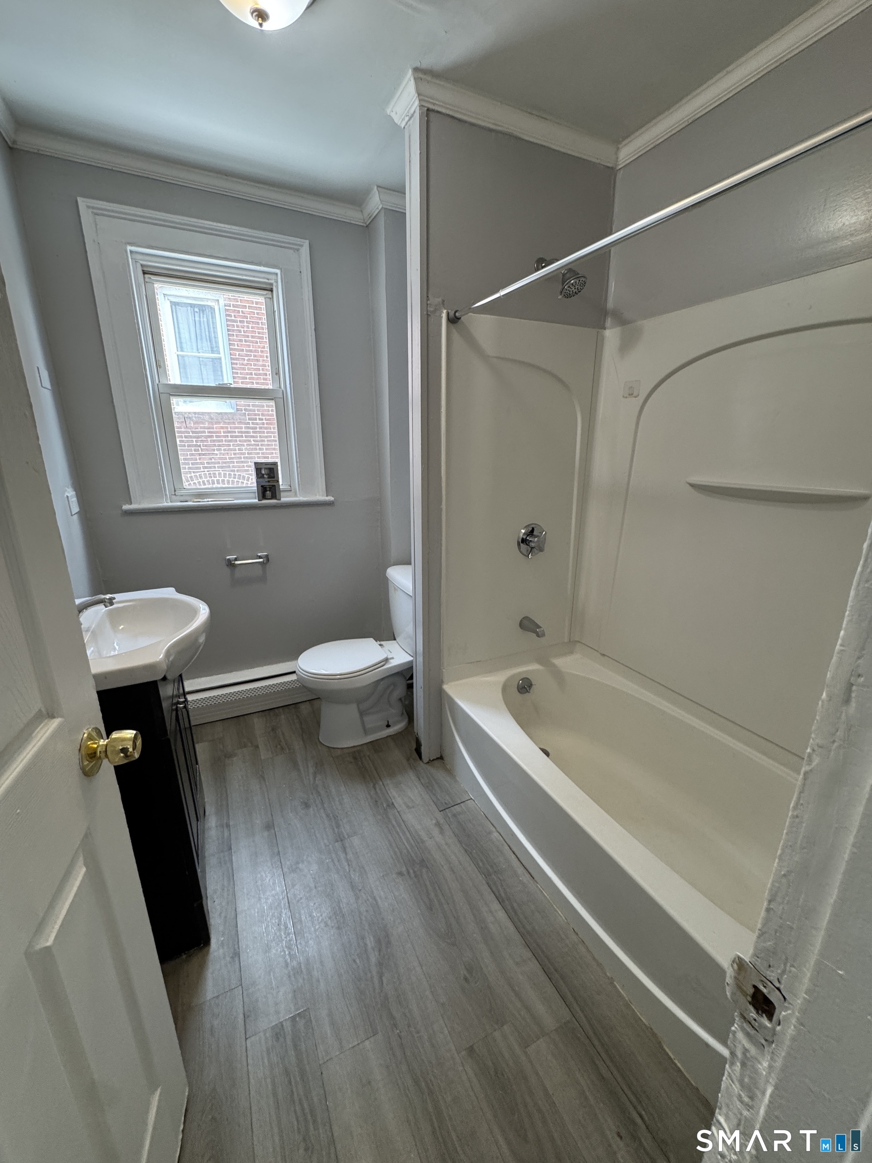 107 Hamilton Street, Unit 2 Hartford, CT 06106 - Photo 6 of 9 a bathroom with a sink a toilet and a bathtub