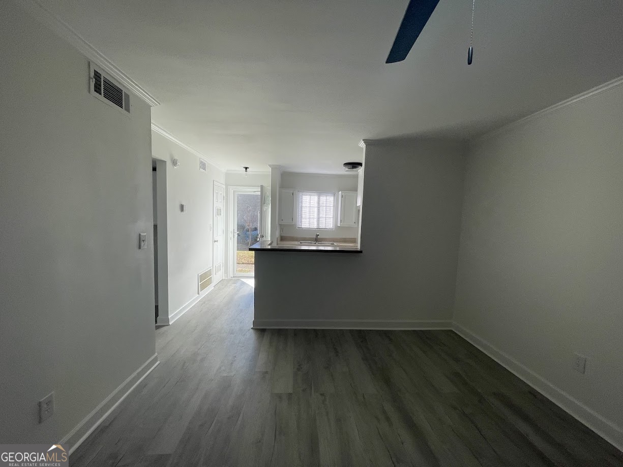 405 Fairburn Road Southwest, Unit 135 Atlanta, GA 30331 - Photo 2 of 10 a view of a room with wooden floor and a window