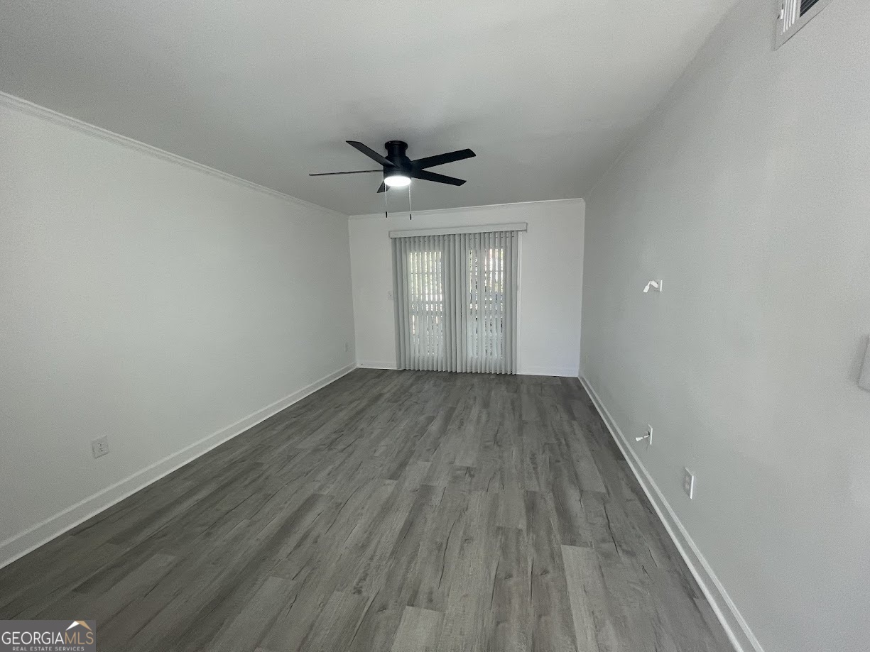 405 Fairburn Road Southwest, Unit 135 Atlanta, GA 30331 - Photo 4 of 10 wooden floor in an empty room with a window