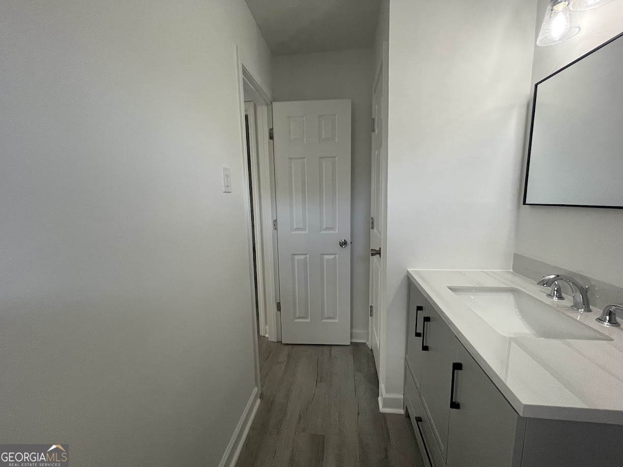 405 Fairburn Road Southwest, Unit 135 Atlanta, GA 30331 - Photo 7 of 10 a bathroom with a sink toilet and vanity