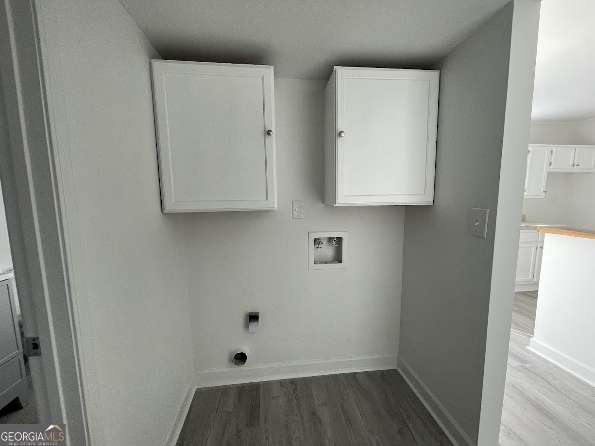 405 Fairburn Road Southwest, Unit 135 Atlanta, GA 30331 - Photo 8 of 10 a room with cabinets and a wooden floor