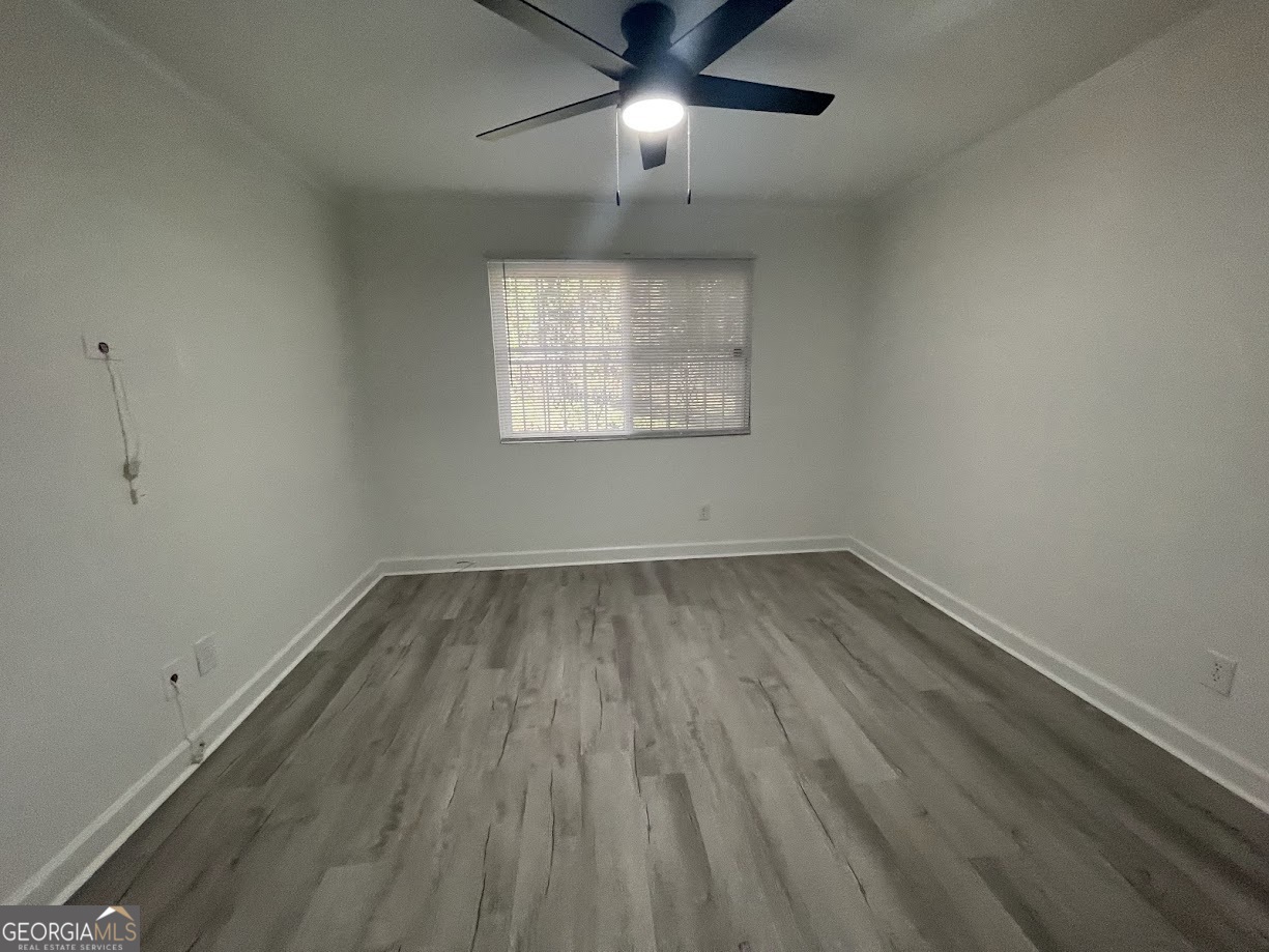 405 Fairburn Road Southwest, Unit 135 Atlanta, GA 30331 - Photo 9 of 10 wooden floor in an empty room with a window