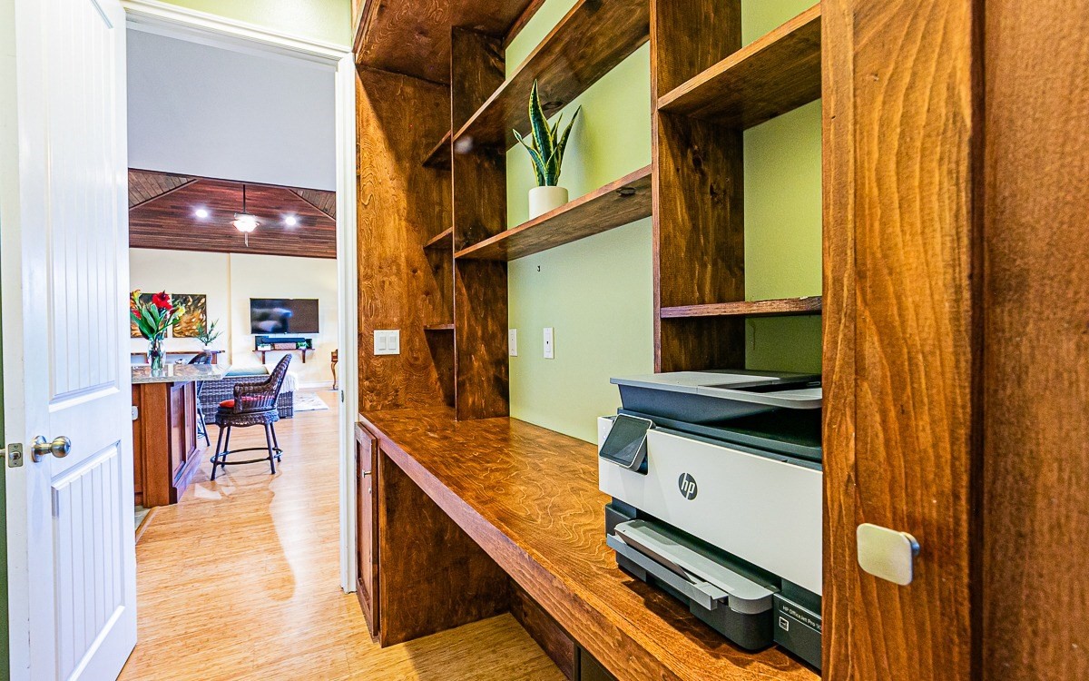 28-256 Akaka Falls Road Honomu, HI 96728 - Photo 16 of 26 a kitchen with stainless steel appliances granite countertop a stove and a sink