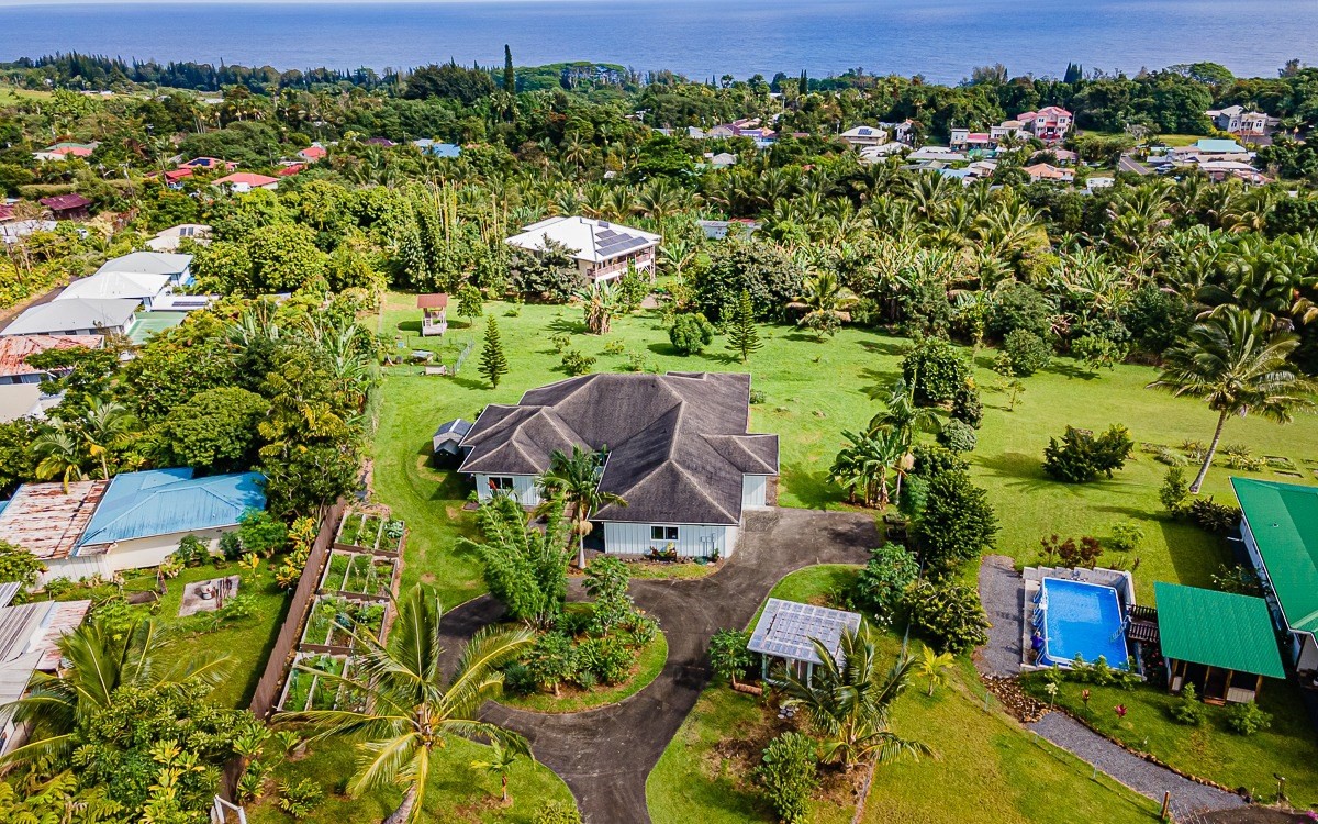 28-256 Akaka Falls Road Honomu, HI 96728 - Photo 2 of 26 an aerial view of a house with a yard