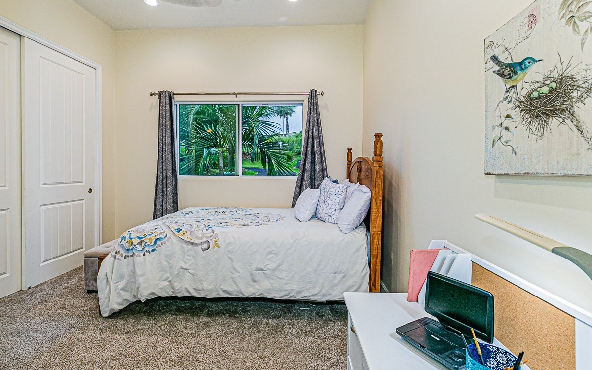 28-256 Akaka Falls Road Honomu, HI 96728 - Photo 23 of 26 a bedroom with a bed and a window