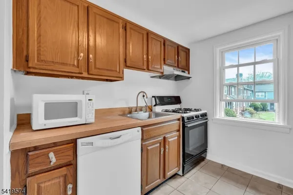 a kitchen with a stove and a sink
