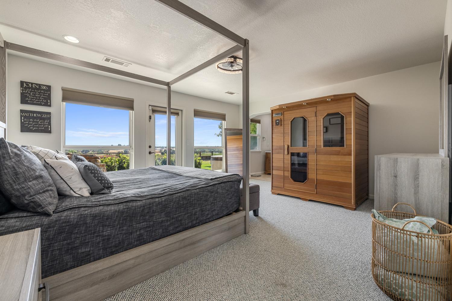 8300 Jantzen Road Modesto, CA 95357 - Photo 21 of 73 a spacious bedroom with a bed and glass door