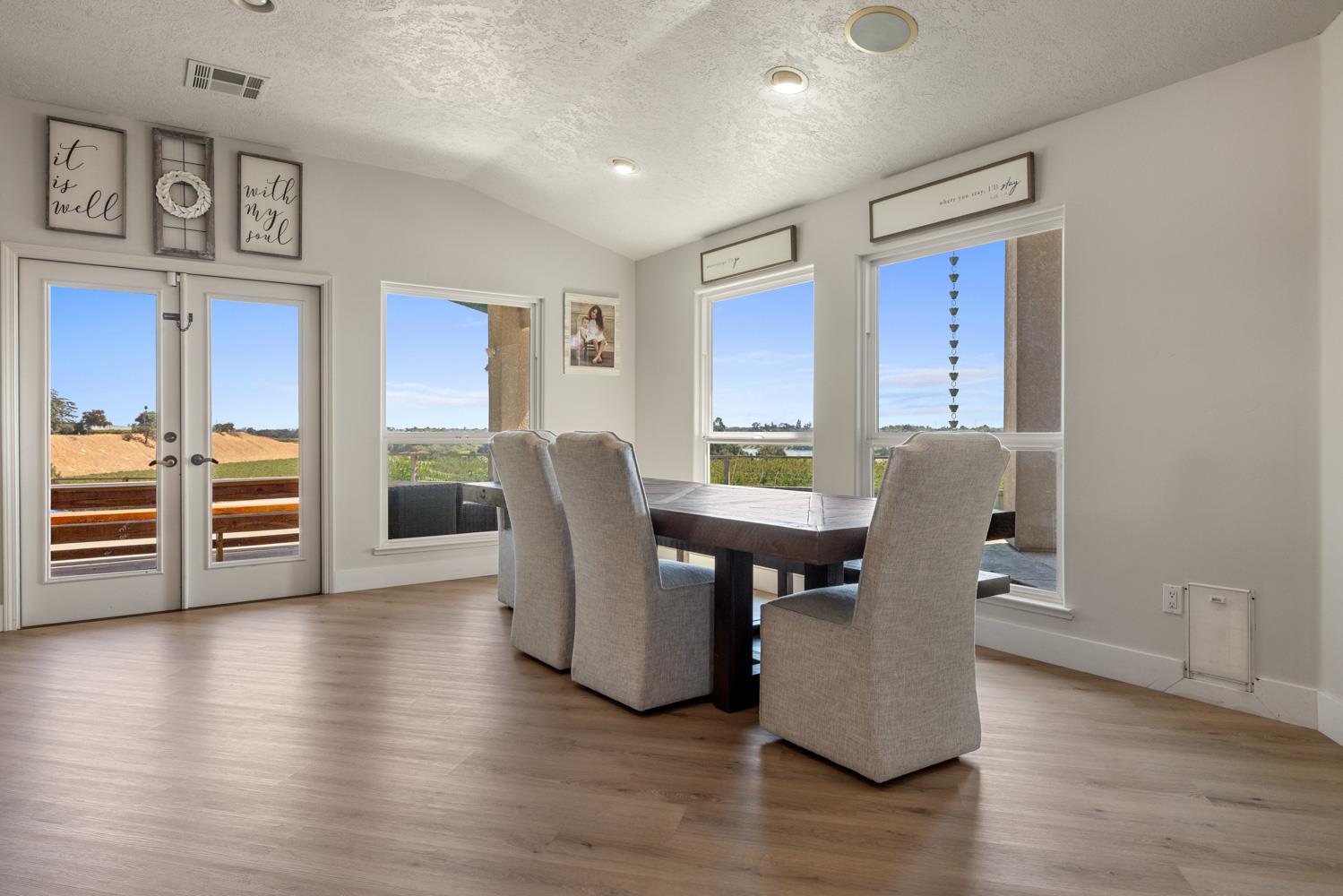 8300 Jantzen Road Modesto, CA 95357 - Photo 31 of 73 a view of a dining room with furniture and wooden floor