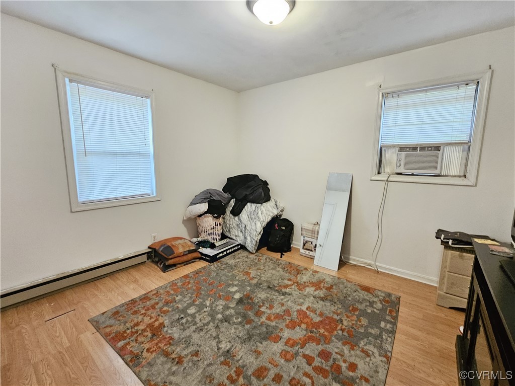 2626 Troublesome Creek Road Dillwyn, VA 23936 - Photo 15 of 24 a bedroom with a bed and wooden floor