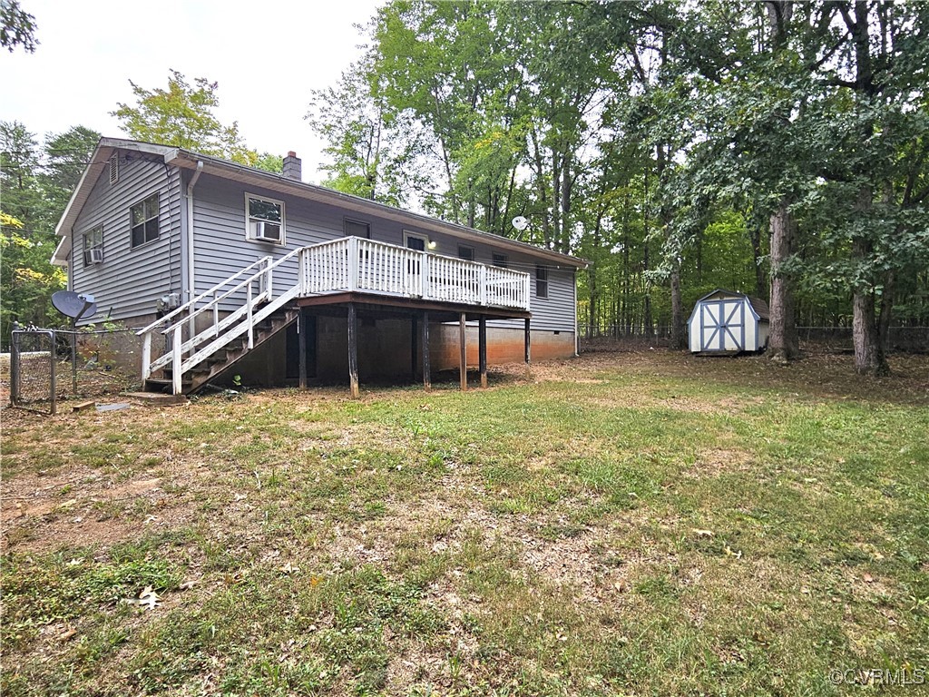 2626 Troublesome Creek Road Dillwyn, VA 23936 - Photo 16 of 24 a front view of a house with a garden and deck