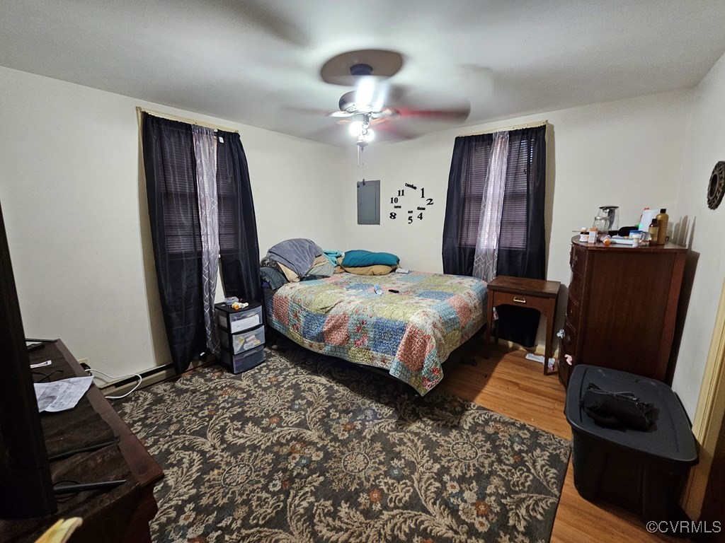 2626 Troublesome Creek Road Dillwyn, VA 23936 - Photo 21 of 24 a bedroom with a bed and wooden floor