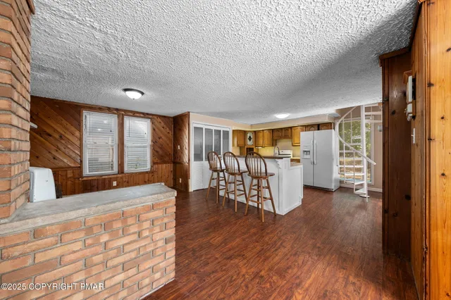 a view of a livingroom with furniture and wooden floor