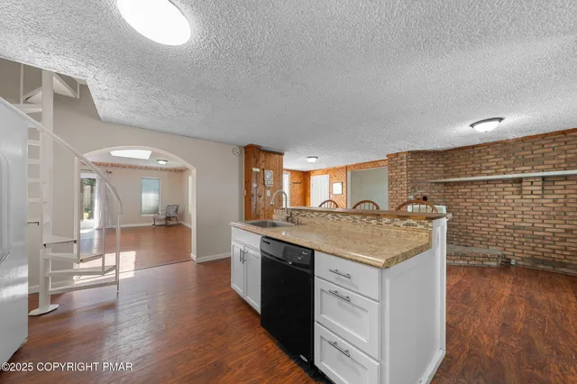 a kitchen with a sink and cabinets