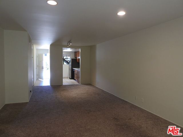 a view of a hallway with stairs