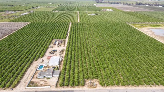 an aerial view of residential house with outdoor space