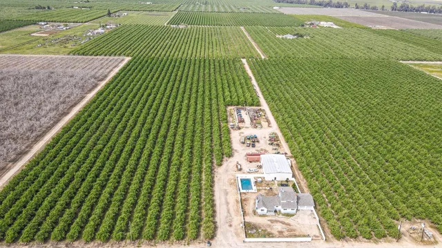 an aerial view of a house with outdoor space