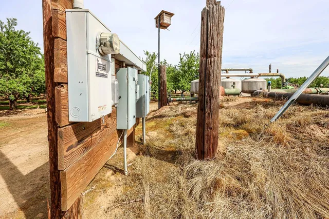 a view of a terrace with chairs and potted plants