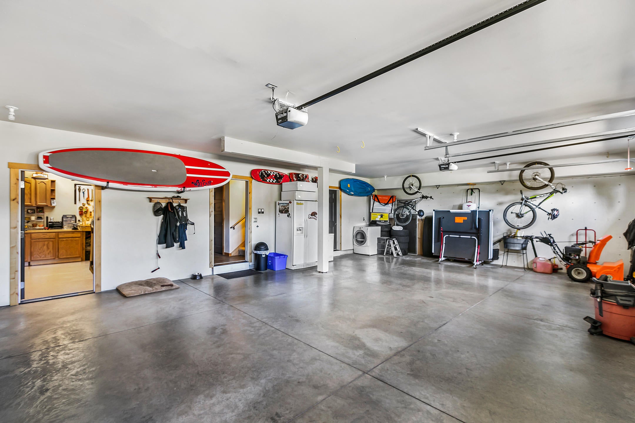 647 Northwest Powell Butte Loop Bend, OR 97703 - Photo 22 of 27 Over sized 3 bay garage. Plenty of room for all your C.O gear