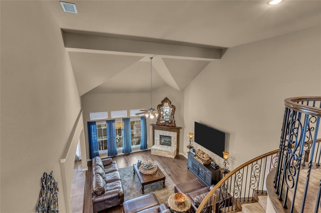 100 Spruce Street Red Oak, TX 75154 - Photo 21 of 32 a living room with furniture and a flat screen tv