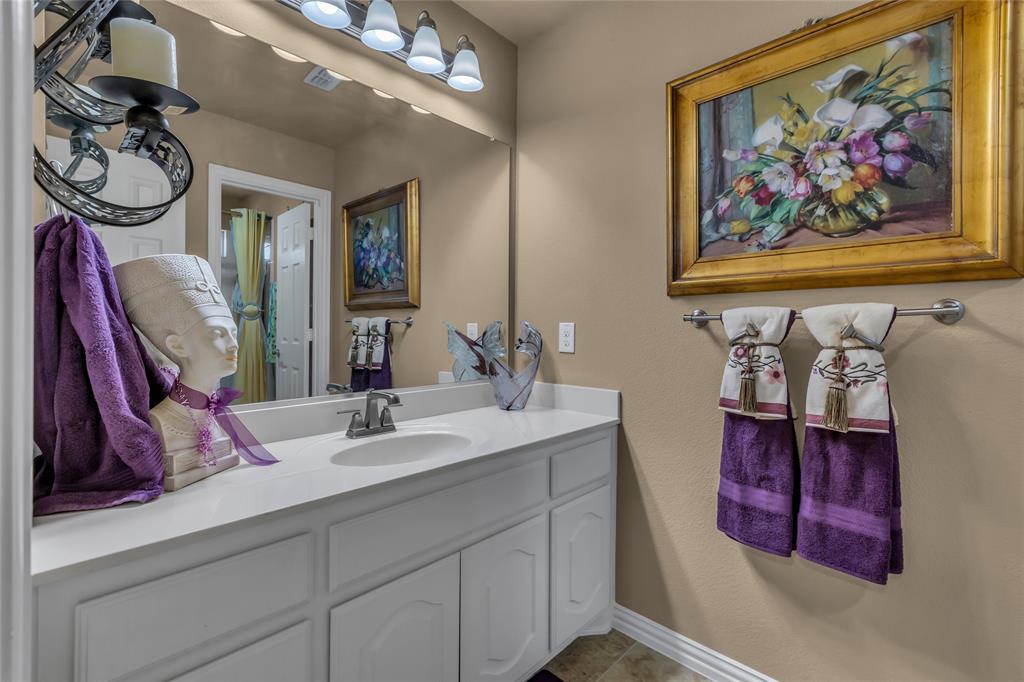 100 Spruce Street Red Oak, TX 75154 - Photo 28 of 32 a bathroom with a mirror and a sink