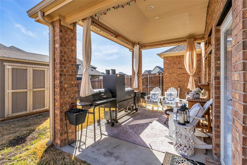 100 Spruce Street Red Oak, TX 75154 - Photo 30 of 32 a view of balcony with chairs and iron fence