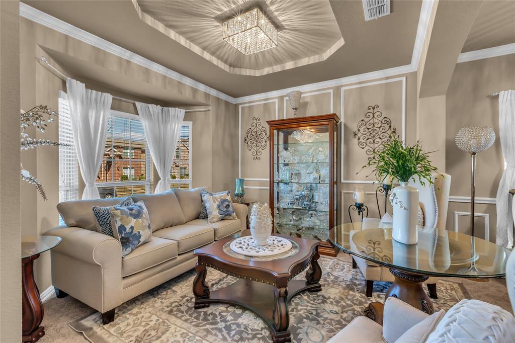 100 Spruce Street Red Oak, TX 75154 - Photo 5 of 32 a living room with furniture a table and a potted plant