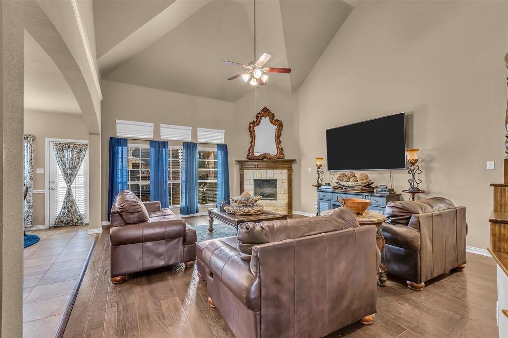 100 Spruce Street Red Oak, TX 75154 - Photo 6 of 32 a living room with furniture and a flat screen tv