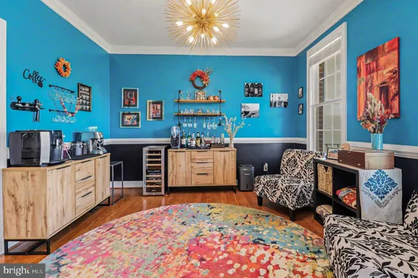 a living room with furniture and a rug