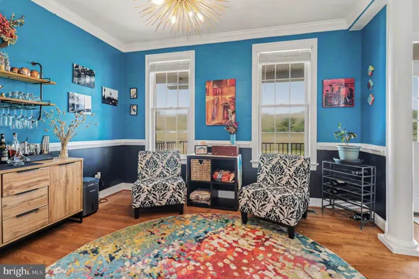 a bedroom with furniture and a fireplace