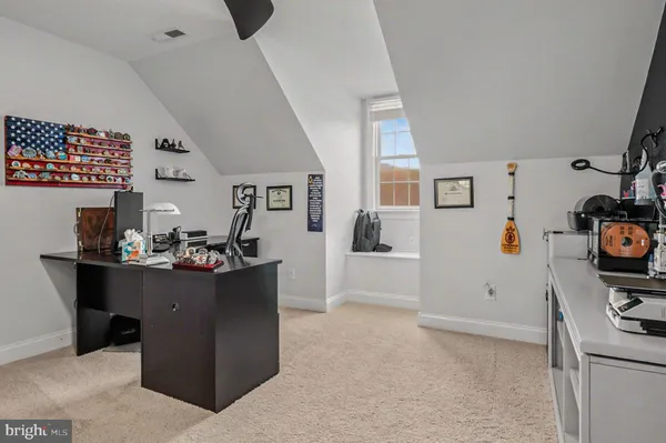 a view of living room with furniture and wooden floor