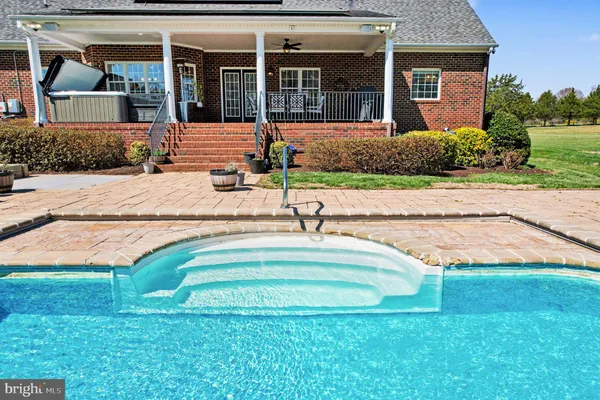a view of a house with a swimming pool