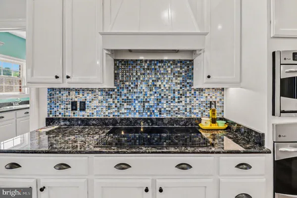 a kitchen with a stove and cabinets