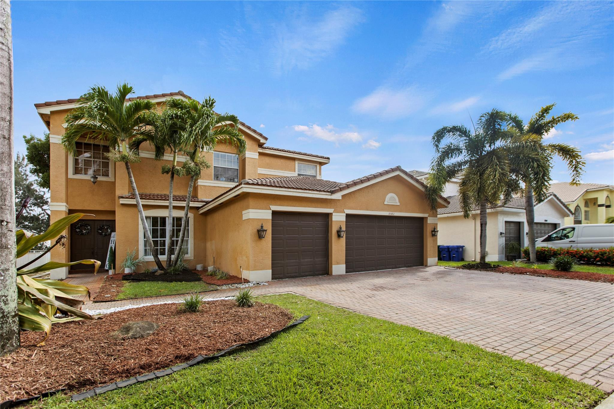 a front view of a house with garden