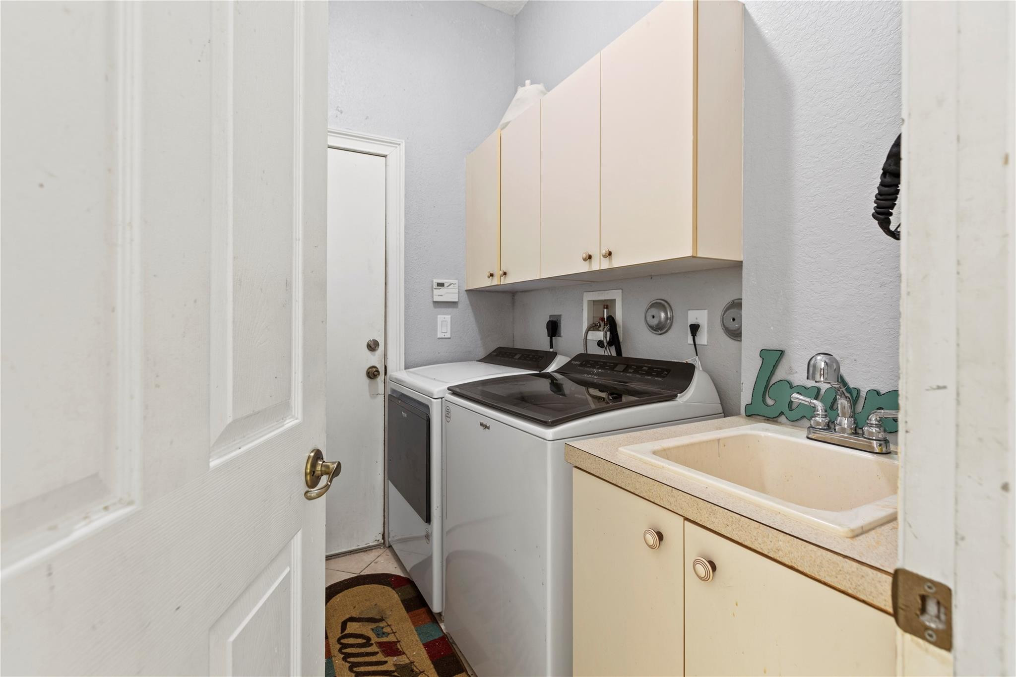 Undisclosed Address Miramar, FL 33029 - Photo 21 of 30 a kitchen with a sink stove and cabinets