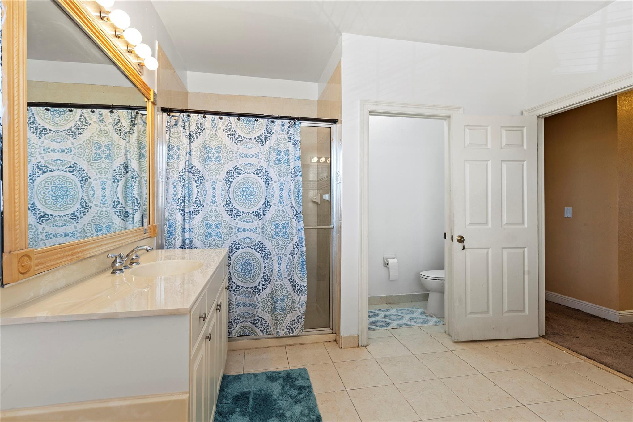 Undisclosed Address Miramar, FL 33029 - Photo 9 of 30 a bathroom with a sink and a mirror