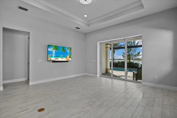 wooden floor and window in an empty room