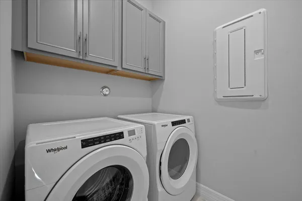 a utility room with dryer and washer