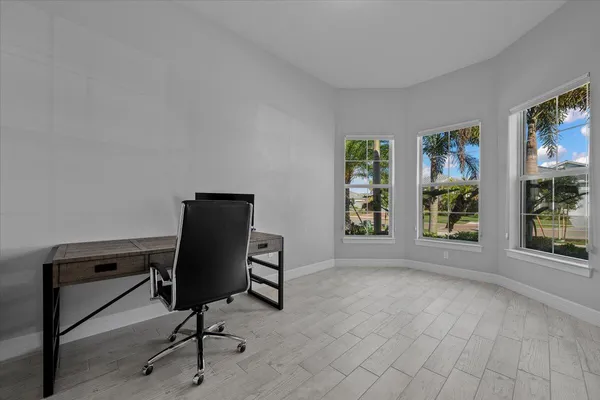 a view of workspace with furniture and window