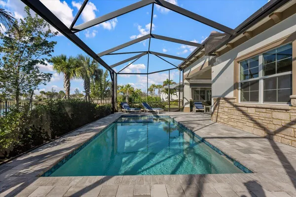 a view of a swimming pool with a patio