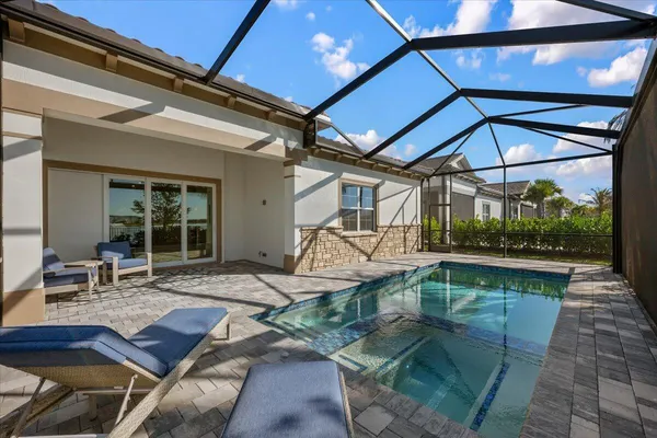 a view of swimming pool with outdoor seating
