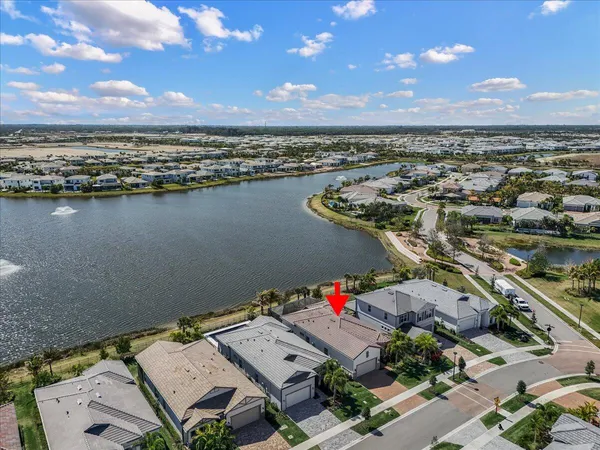 an aerial view of residential building and lake