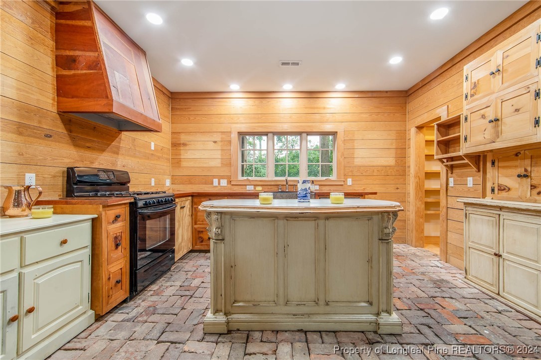 222 Goodwill Road Southern Pines, NC 28387 - Photo 20 of 49 a kitchen with kitchen island granite countertop a sink and counter space