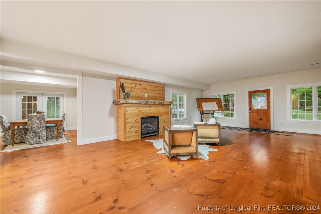 222 Goodwill Road Southern Pines, NC 28387 - Photo 21 of 49 a view of a livingroom with furniture and a fireplace