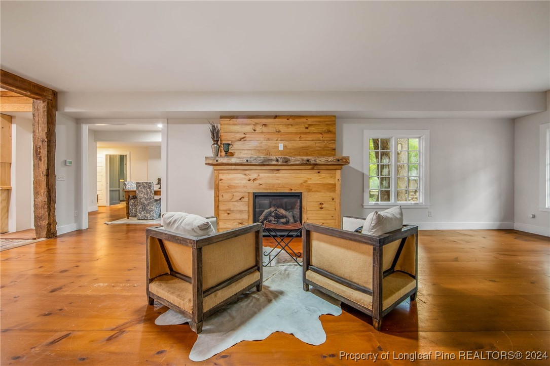 222 Goodwill Road Southern Pines, NC 28387 - Photo 22 of 49 a living room with furniture and a fireplace