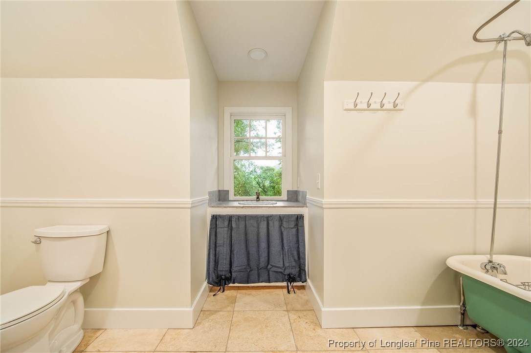 222 Goodwill Road Southern Pines, NC 28387 - Photo 30 of 49 a bathroom with a toilet and a shower