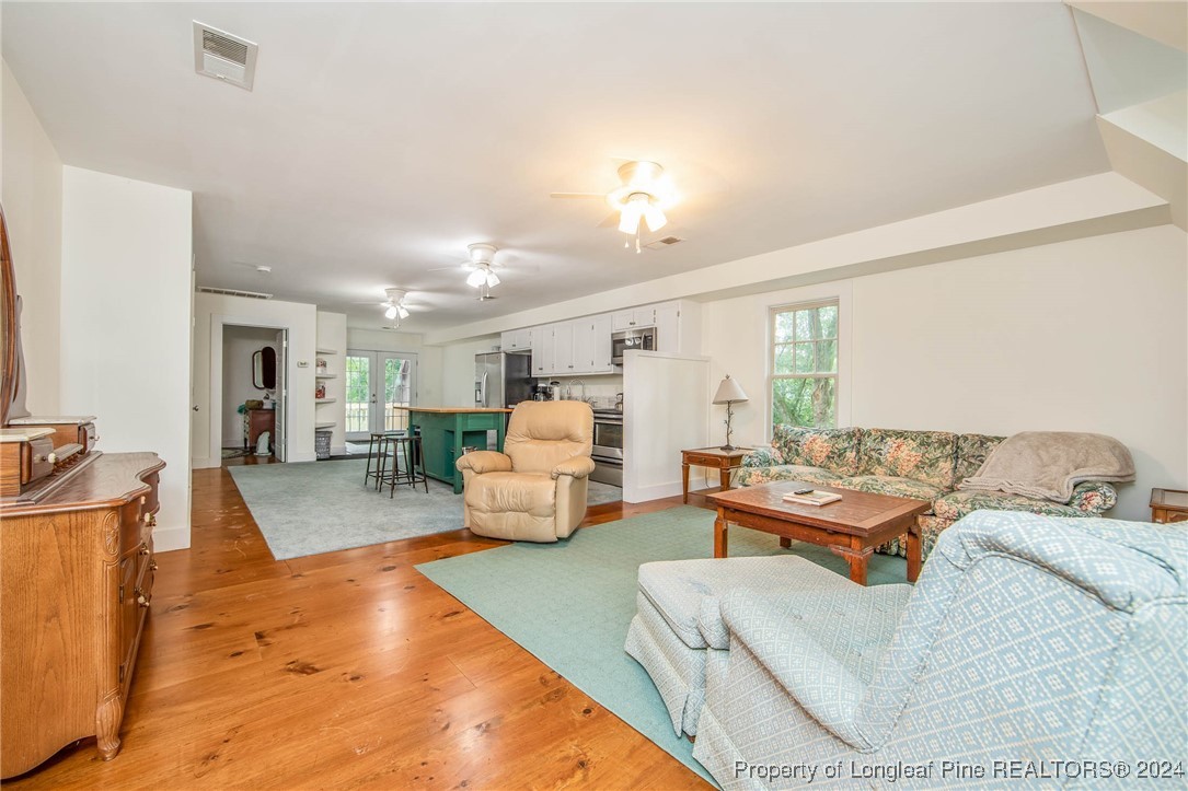 222 Goodwill Road Southern Pines, NC 28387 - Photo 33 of 49 a living room with furniture and a large window