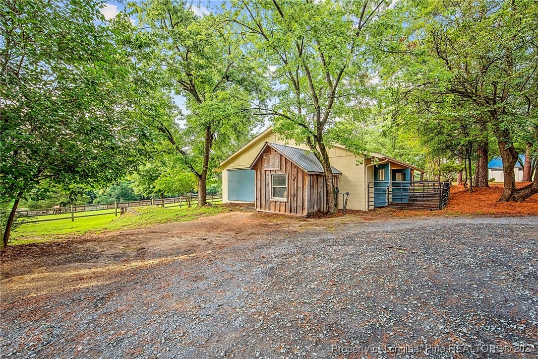 222 Goodwill Road Southern Pines, NC 28387 - Photo 36 of 49 a house with trees in the background